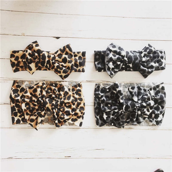 Baby headbands with bow in leopard and snow leopard prints.