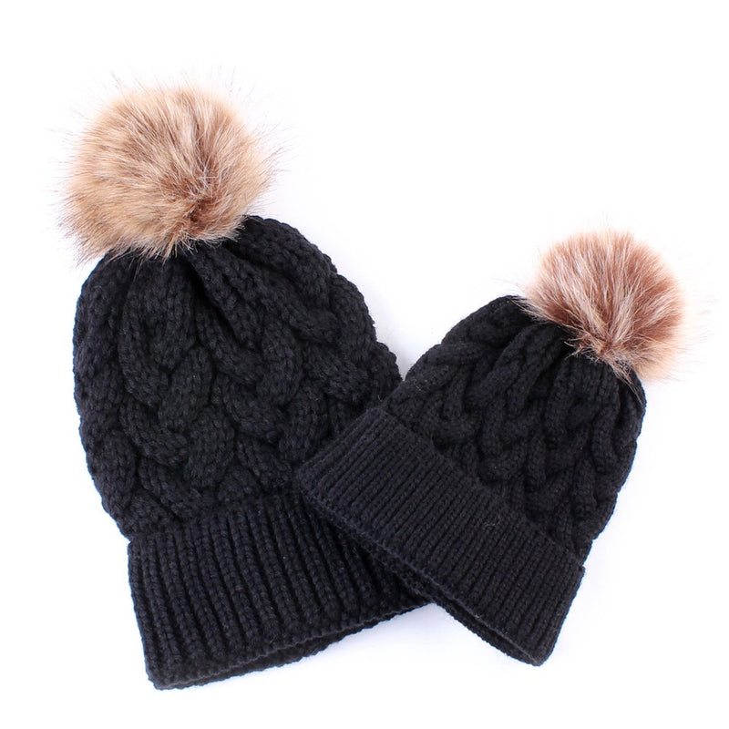 Mommy and baby knitted pom pom hat in black.