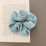 Handmade ribbed scrunchies in light blue.