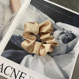 Handmade silk scrunchie in champagne colour.