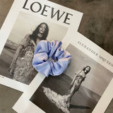 Handmade silk scrunchie in blue.