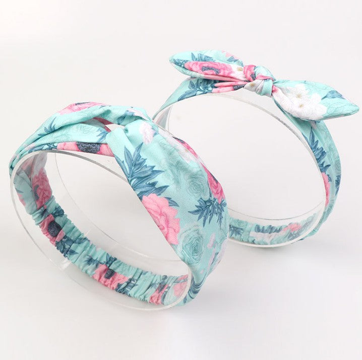 Mommy and baby matching headband set in blue and pink tropical print.