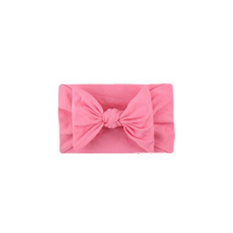 Soft fit headband with bow in hot pink.