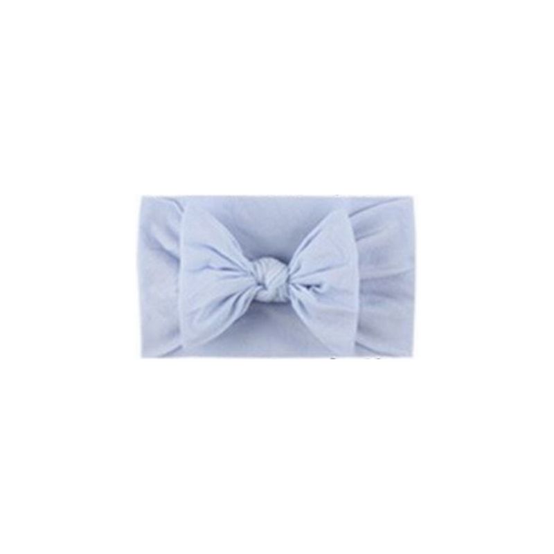 Soft fit headband with bow in light blue.