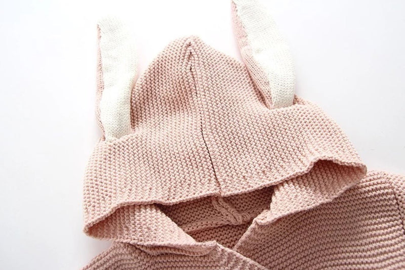 Close up of the bunny ears hood in light pink.