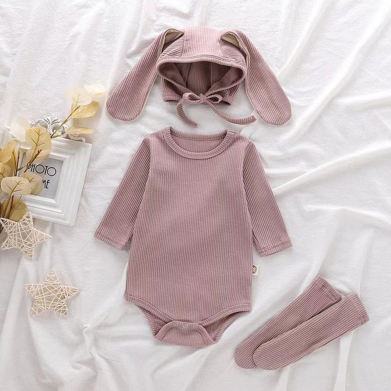 3 piece baby set with bunny ears hat, long sleeve onesie and socks in mauve.