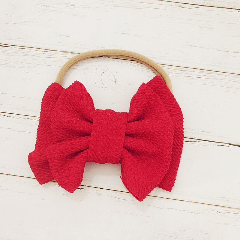 Red oversized bow headband.