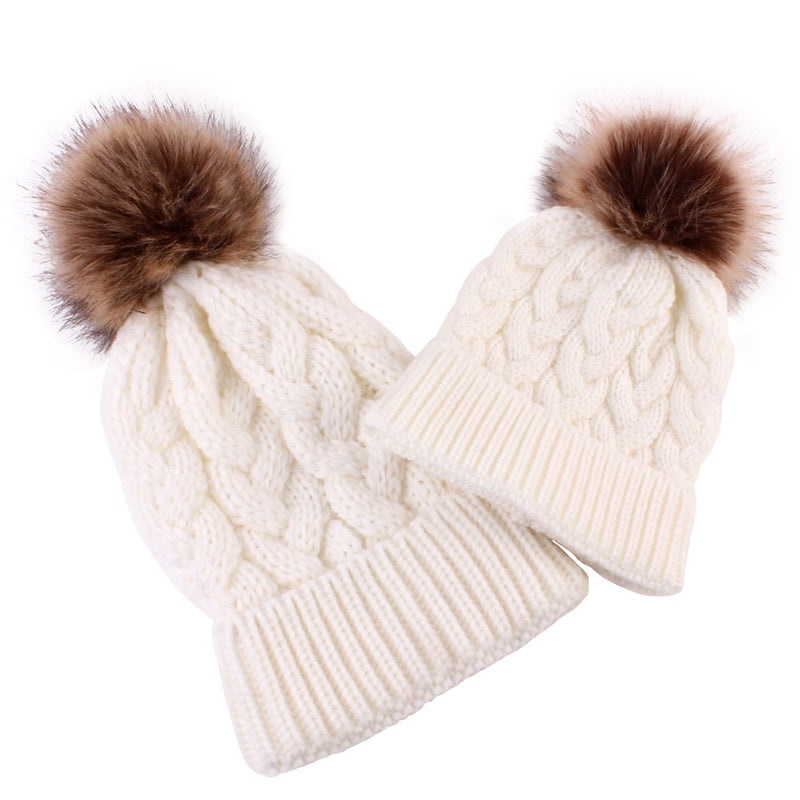 Mommy and baby knitted pom pom hat in white.