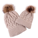 Mommy and baby knitted pom pom hat in tan.