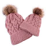 Mommy and baby knitted pom pom hat in blush pink.