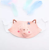 One light pink reusable kids' face mask on a white background with a cute cat face printed on the mask.