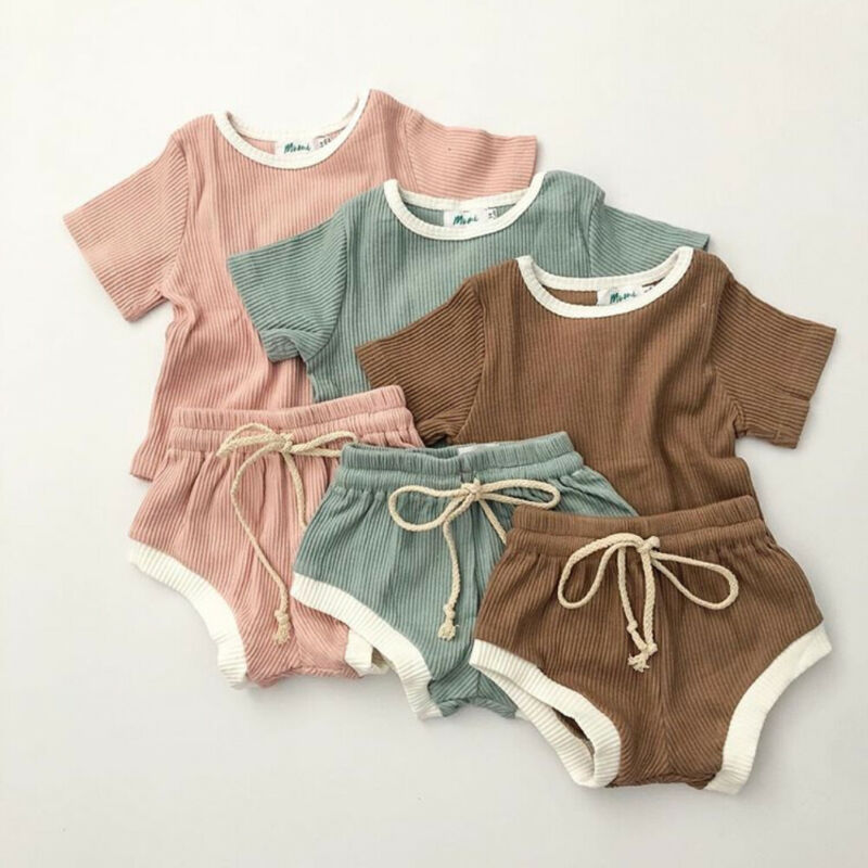 Unisex 2 piece cotton tee shirt and shorts set in light pink, sage green and brown.