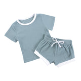 2 piece cotton tee shirt and shorts set in sage green with white trim.