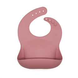 Reusable silicone bib in pink.