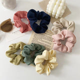 Handmade ribbed scrunchies in various colours.