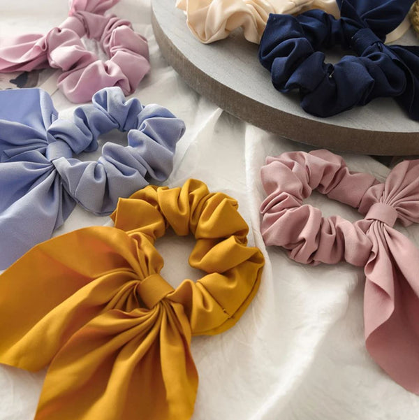 Handmade bunny ears scrunchie in navy, mustard, pink, blue and cream.