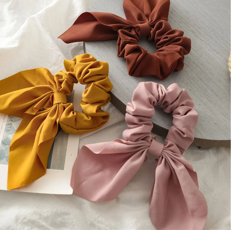 Handmade bunny ears scrunchie in brown, mustard and pink.