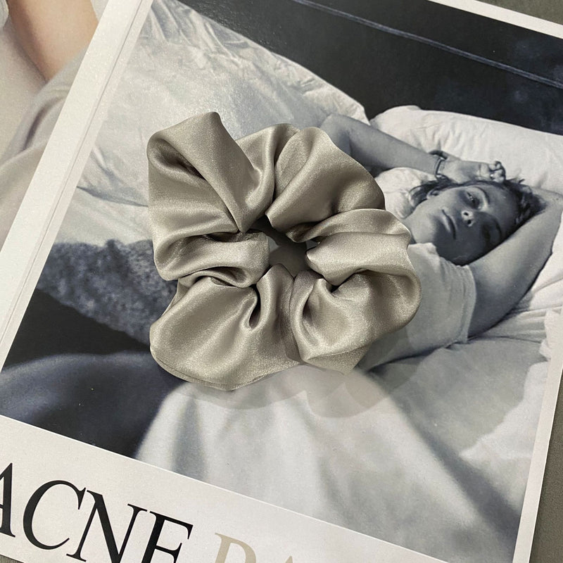 Handmade silk scrunchie in light gray.