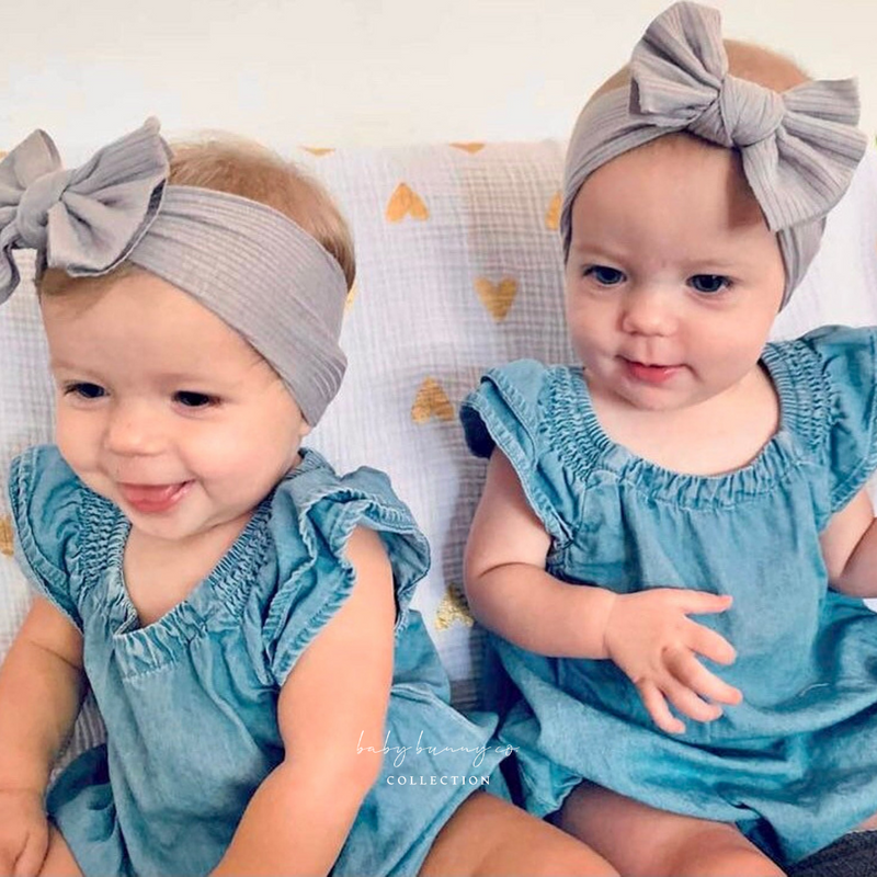 Jersey Ribbed Headband Bow - Baby Bunny Co. Two twin baby girls in matching headband in blue denim summer dress.