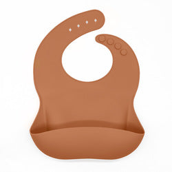 Reusable silicone bib in brown.