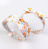Mommy and baby matching headband set in blue and orange floral print.