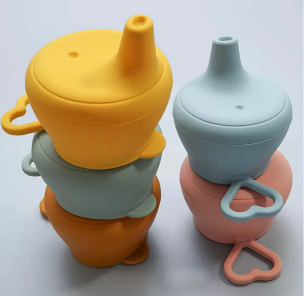 Kids' silicone leak proof lid in yellow, sage green, orange, blue and pink.