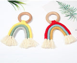 Handmade rainbow macrame wooden teether in yellow and red.